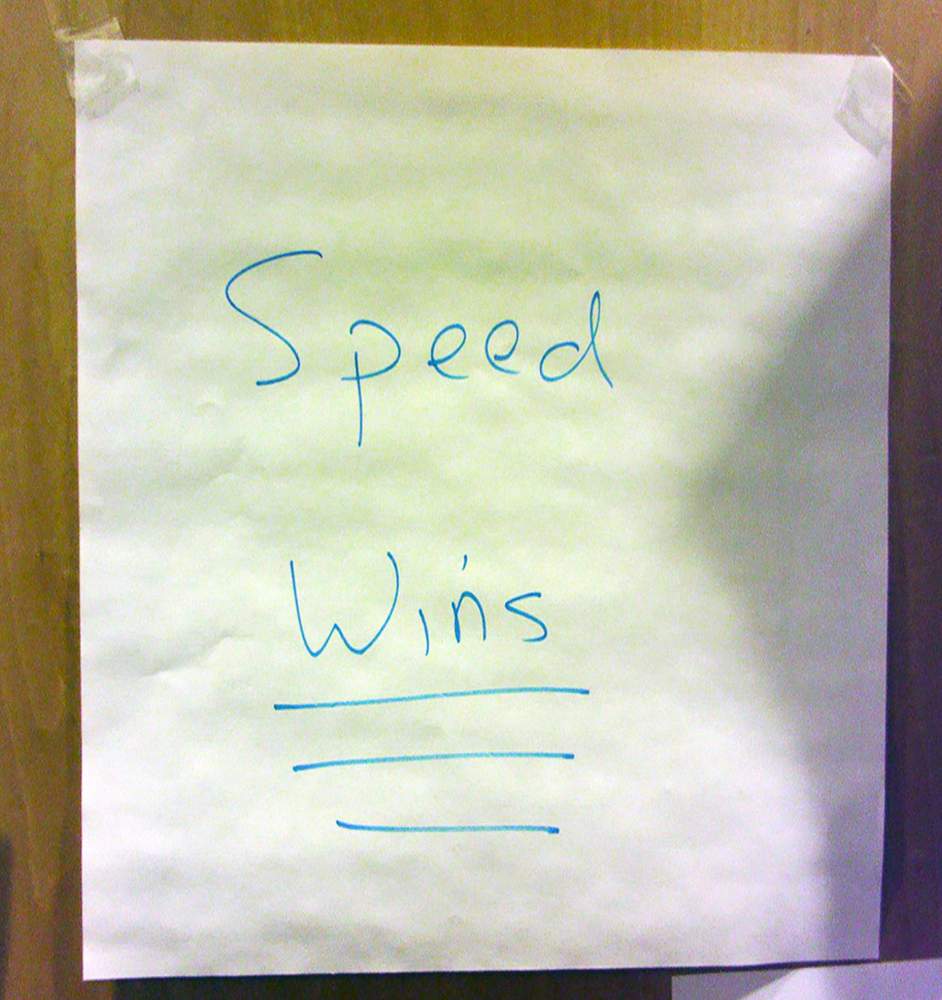 The 'Speed Wins' sign on Kaufer's office door