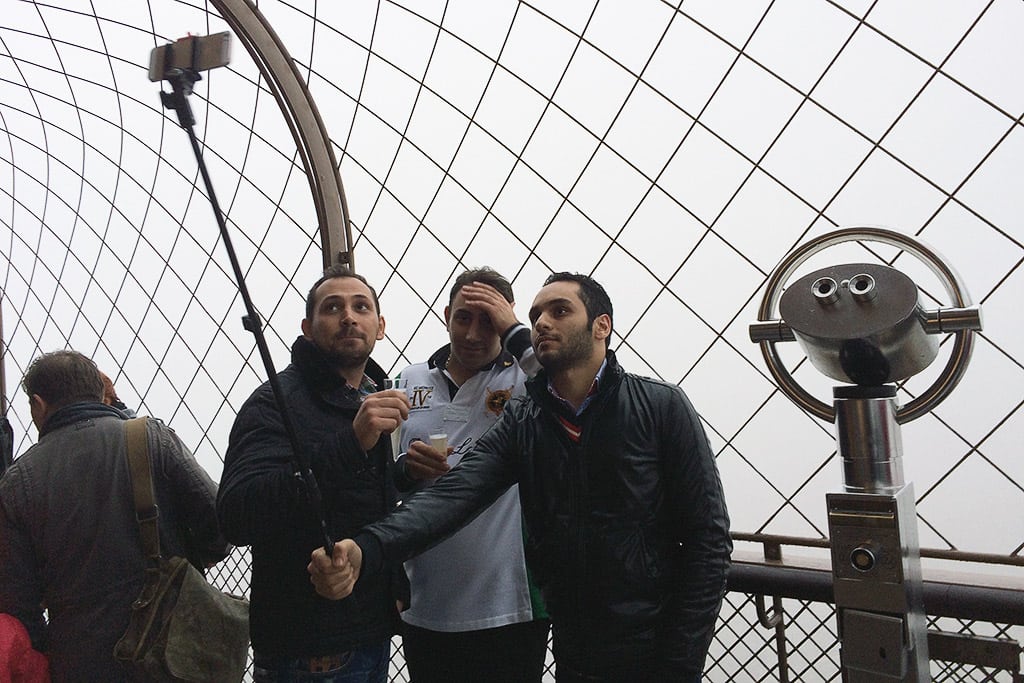 Tourists with selfie stick in Paris
