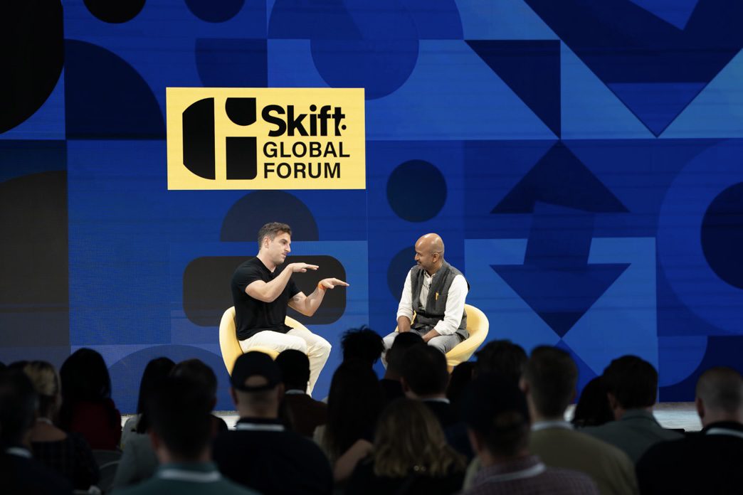 Airbnb CEO Brian Chesky on stage at Skift Global Forum