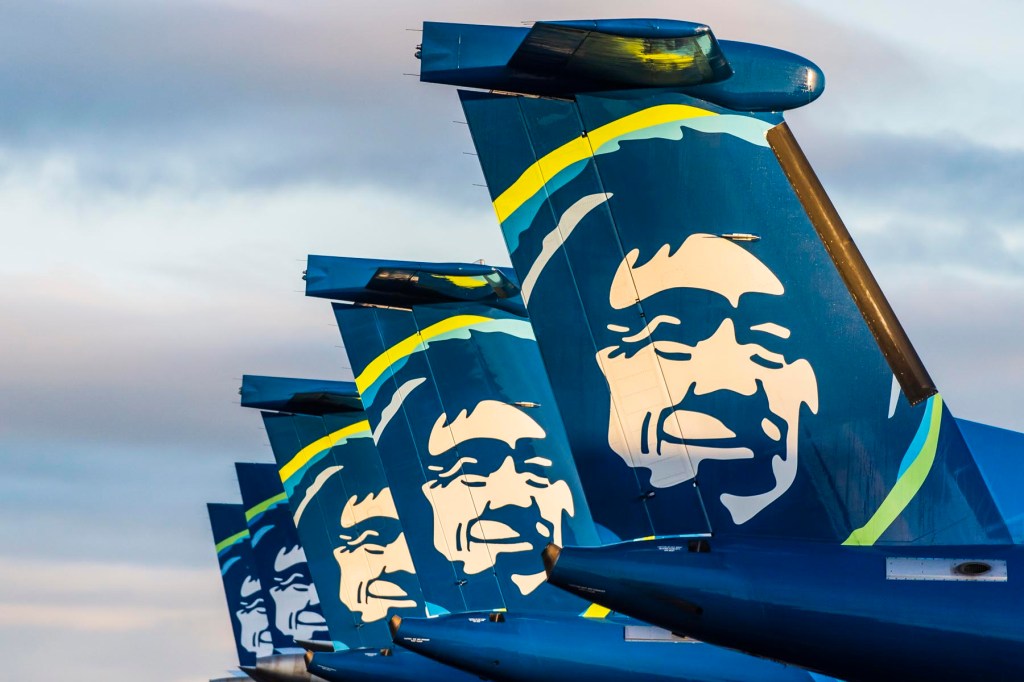 Five aircraft tails from Alaska Airline on the tarmac