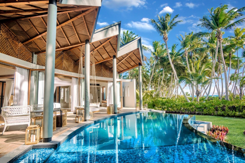A view of the pool and guest room balconies at the Waldorf Astoria Seychelles Platte Island, which opened in January 2024