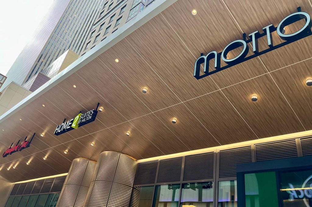 Three hotel brand signs on one building