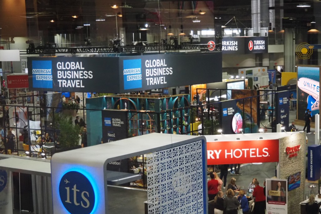 a sign saying american express global business travel at the global business travel association conference in atlanta in july 2024