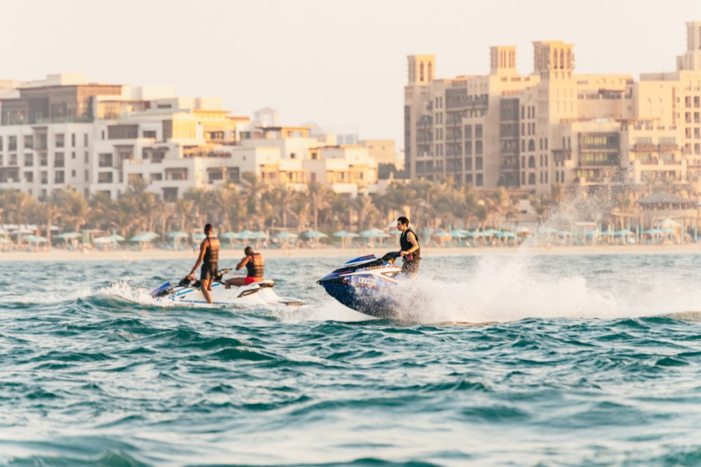 tourists on jetskis in dubai