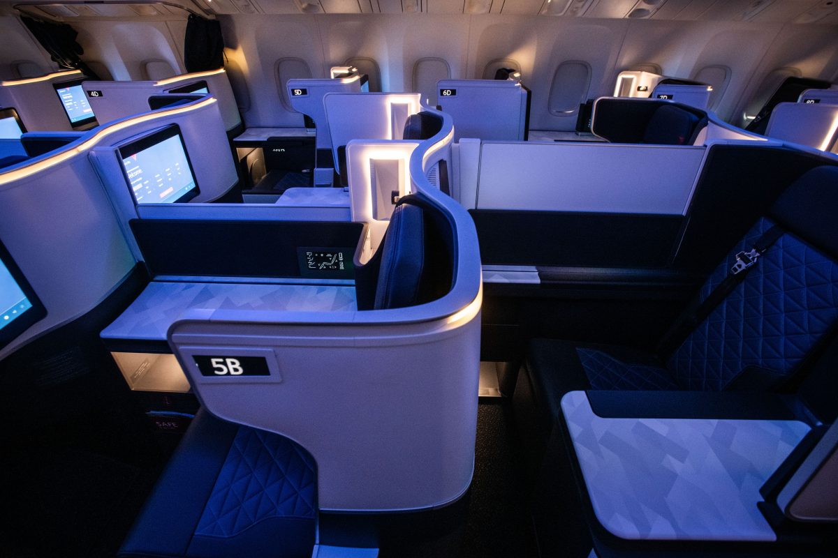 The interior of a Delta plane showing business class seats.