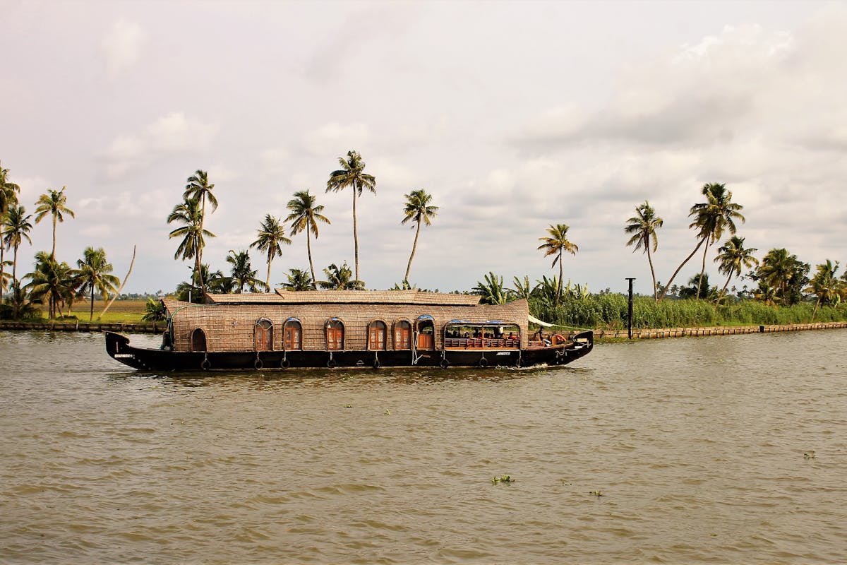 A houseboat cruising in Kerala's backwaters.