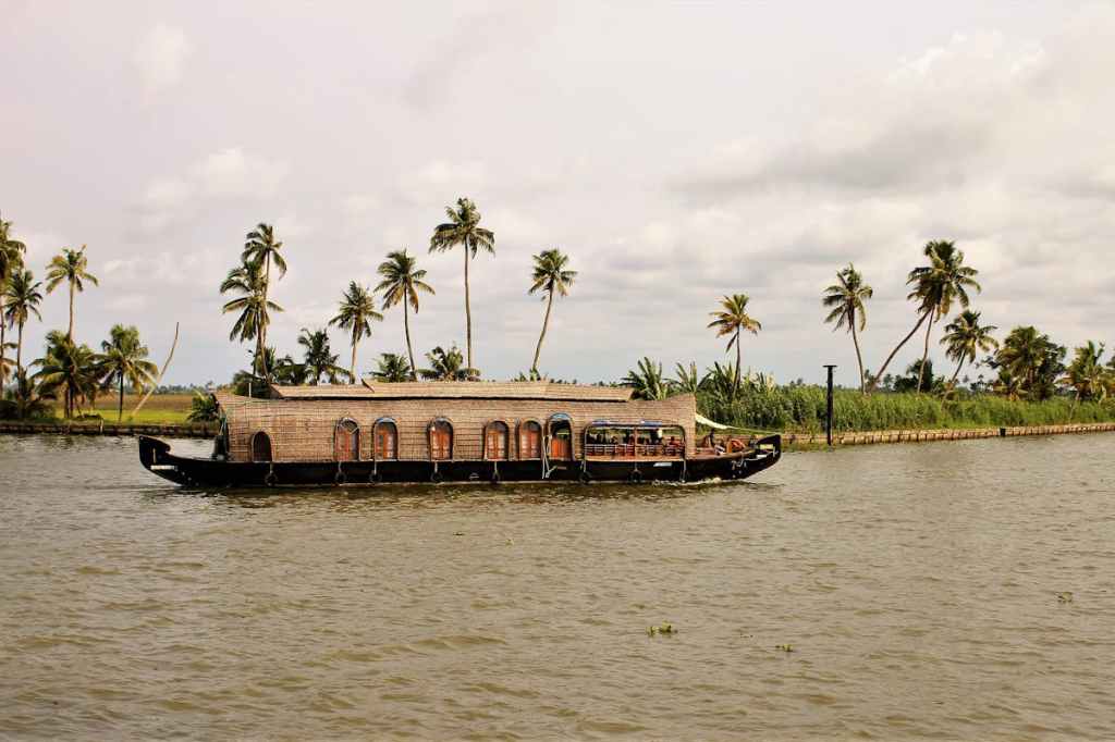 A houseboat cruising in Kerala's backwaters.