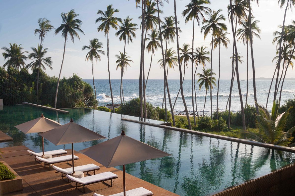 view of a tropical swimming pool at an ultra luxury hotel