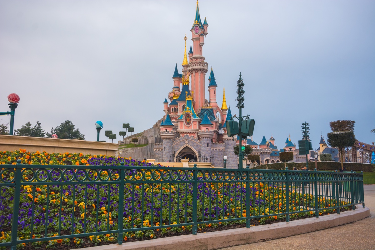 View of a pink-ish theme park castle.