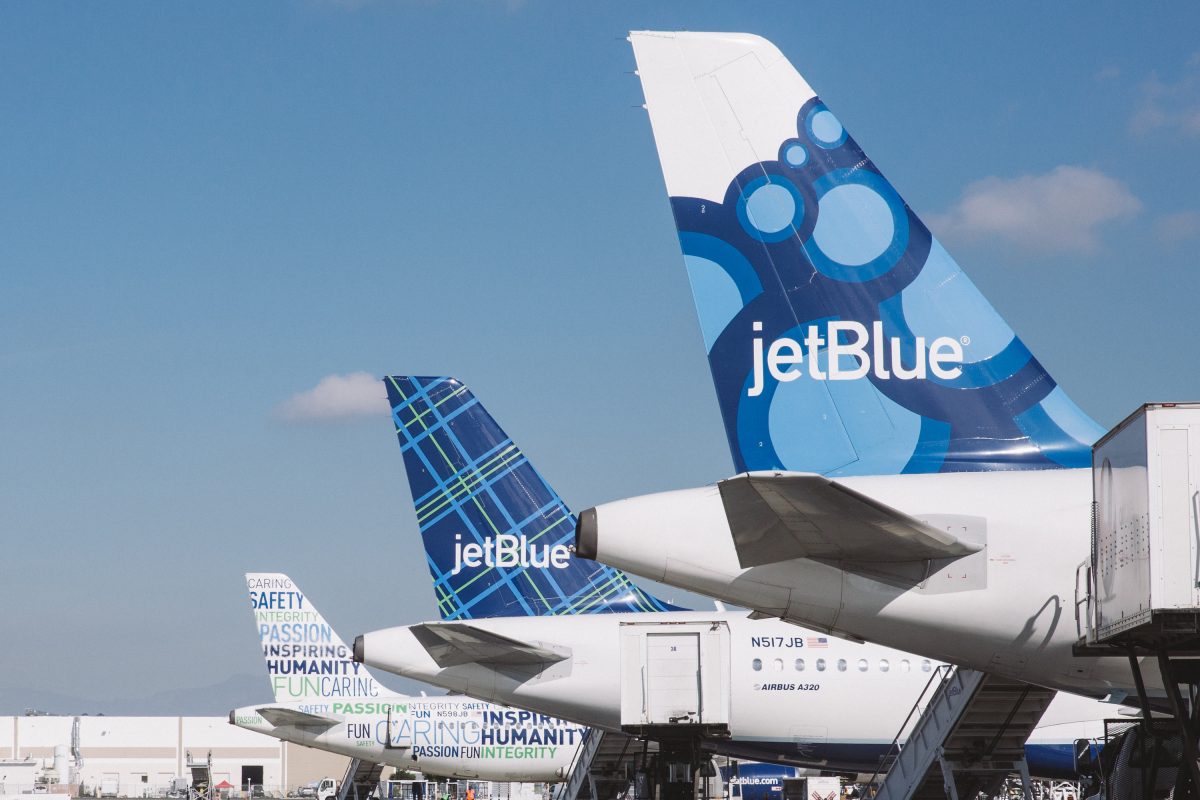 JetBlue aircraft parked at the airport.