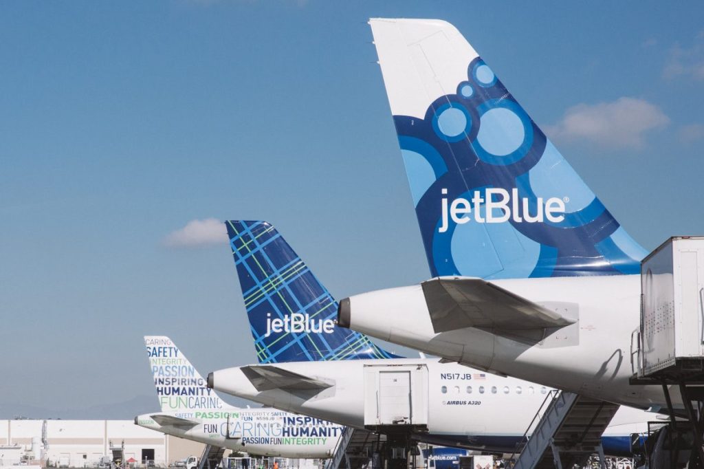 JetBlue aircraft parked at the airport.