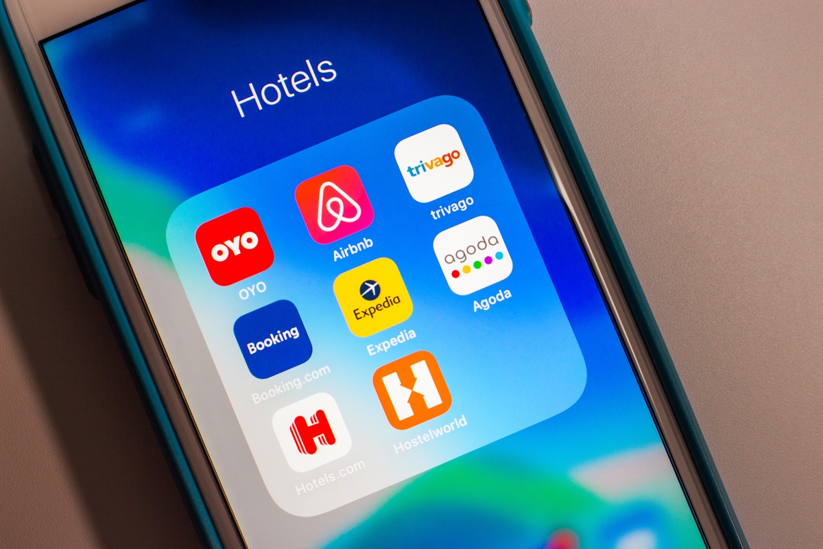 Hotel and booking apps on a smartphone screen.