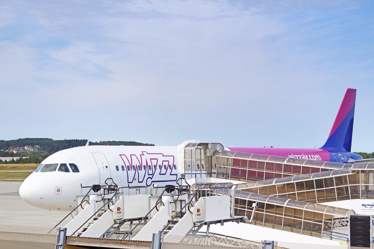 An airplane on the tarmac with steps