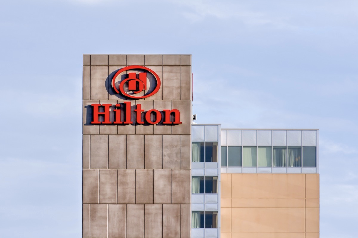 Exterior of the top floors of a Hilton hotel