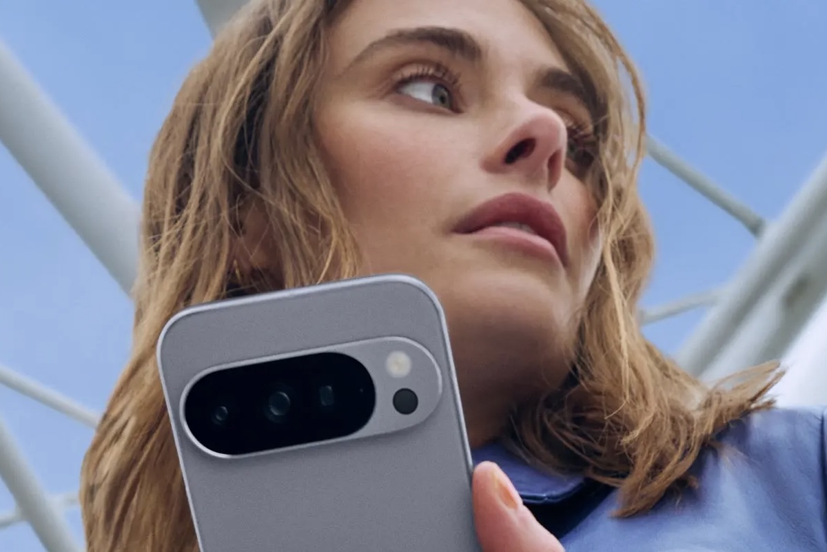 A woman holding a Google Pixel phone.