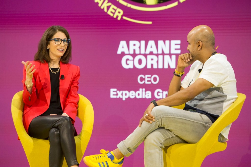 A woman and a man in an on-stage interview at Skift Global Forum 2025.