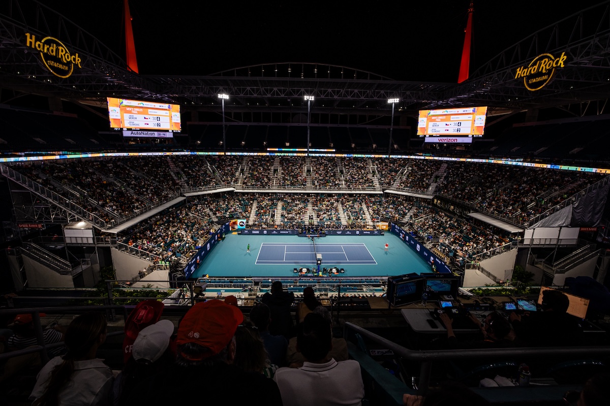A wide shot of a crowd at the Hard Rock Stadium in Miami Gardens, Florida, watching the Miami Open tennis tournament.