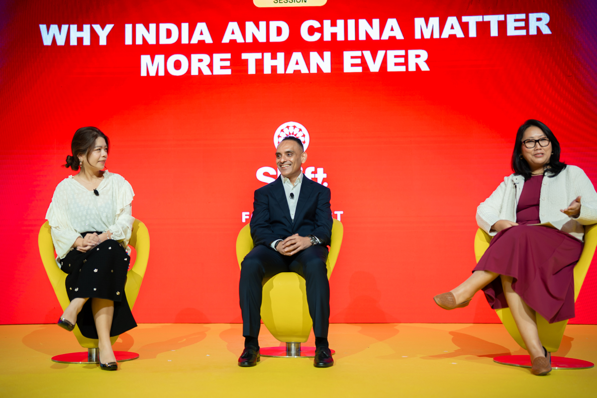 Three people in conversation on stage.