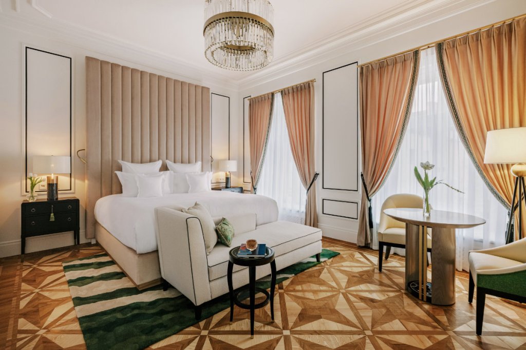 a guest room at a luxury hotel seen during the day