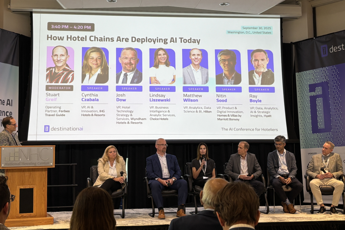 hotel executives talking on a stage