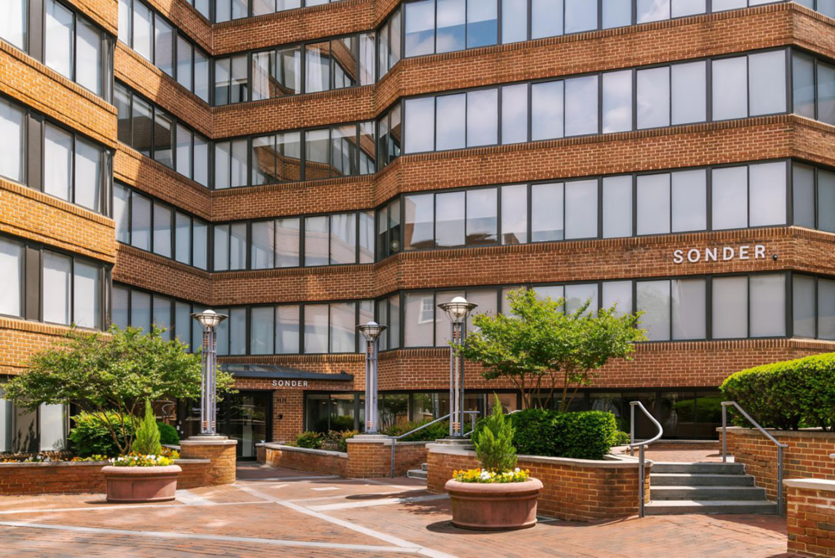 Exterior view of a Sonder Hotel in the Georgetown District of Washington DC on a sunny day.