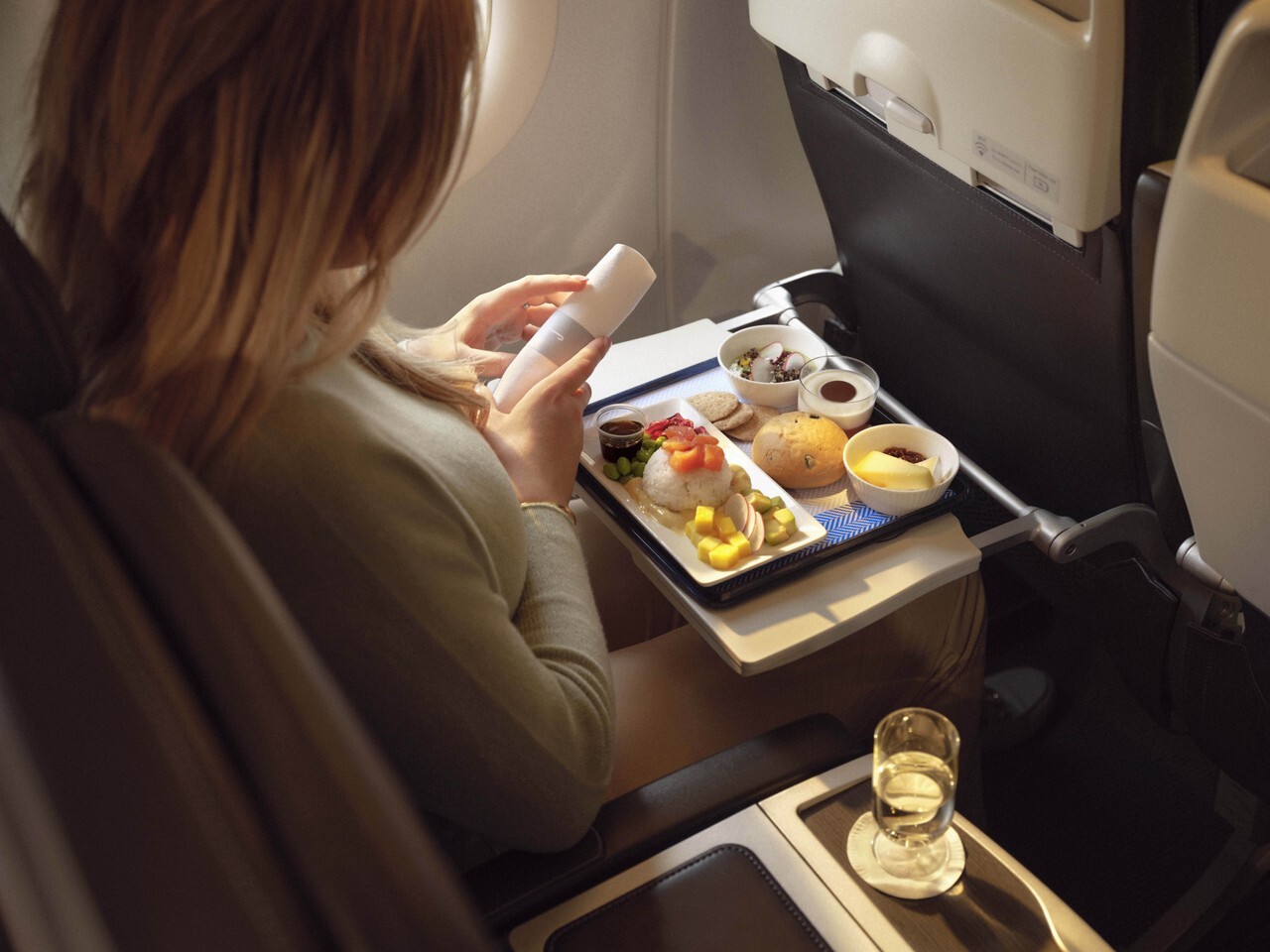 A British Airways Club Europe passenger with a meal.
