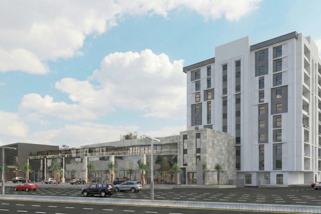 A rendering of a planned midscale hotel branded Element in Saudi Arabia. Shows a hotel on a sunny day.