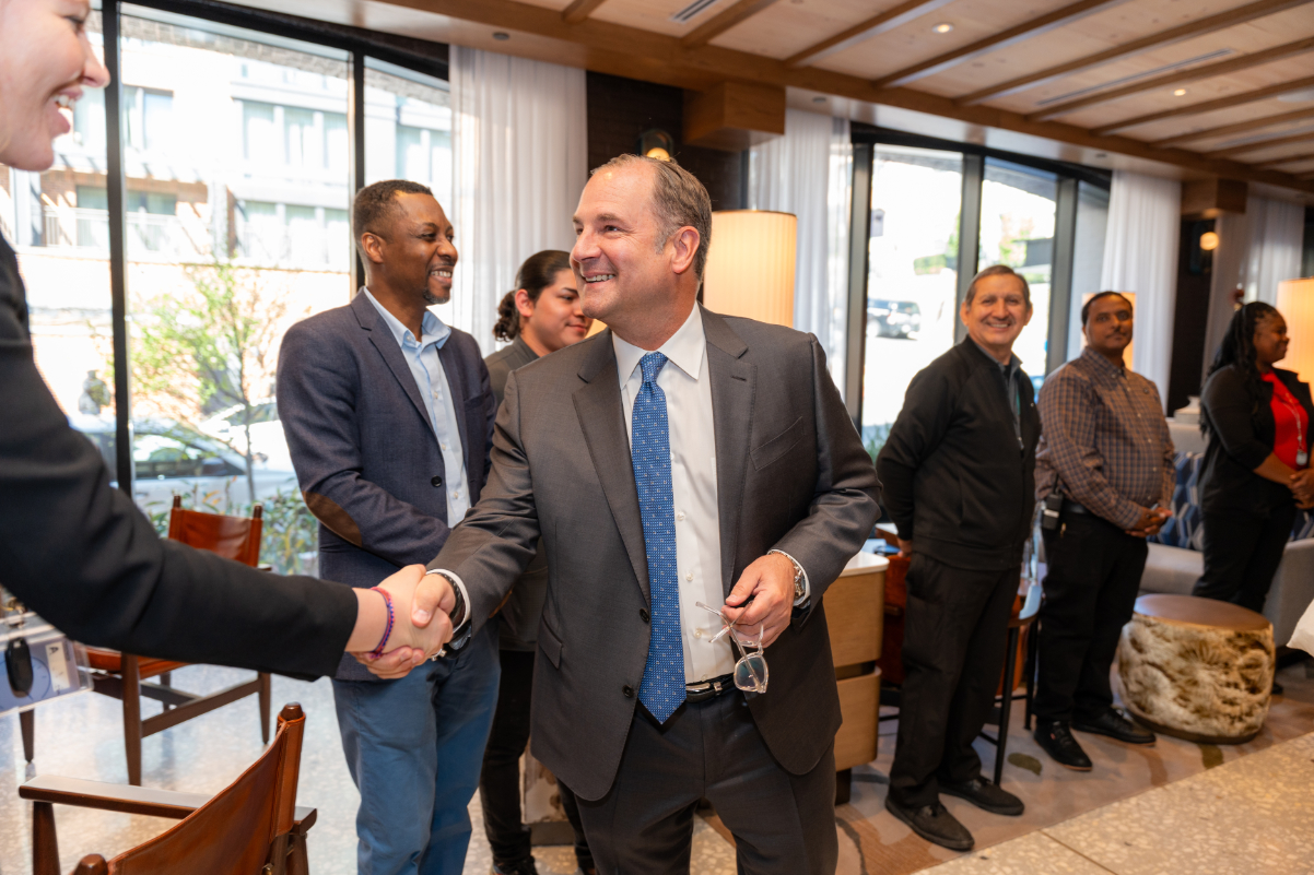 image of a marriott hotel ceo in a suit shaking hands