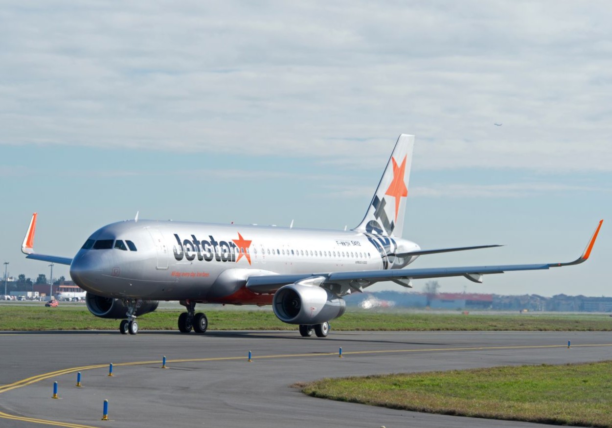 A Jetstar Japan taxiing at the airport