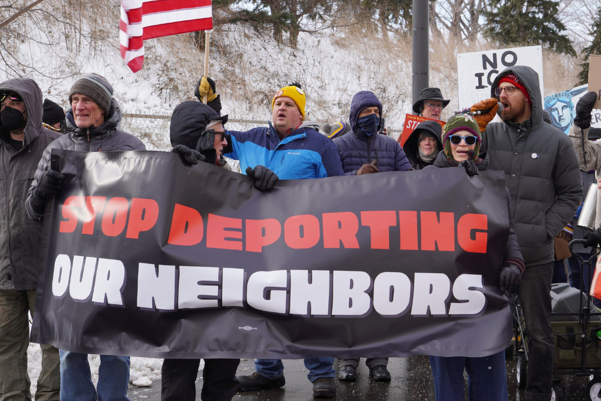 union protestors outdoors in the cold, upset at Trump administration policies around immigration enforcement